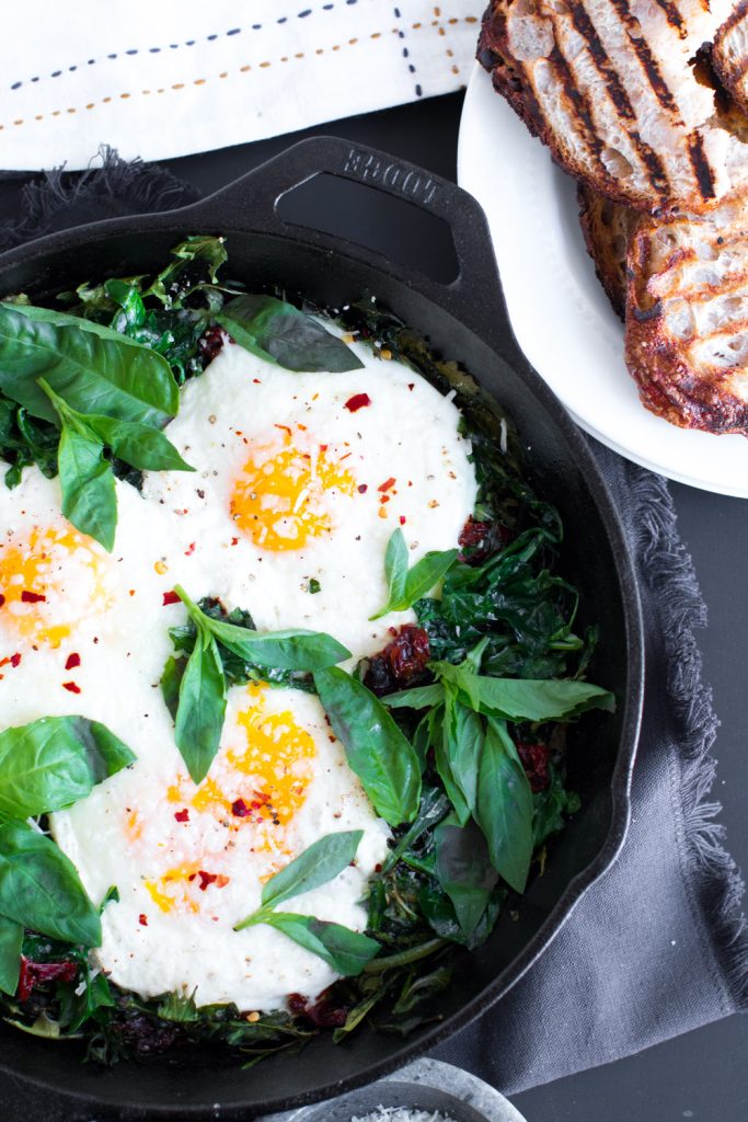 Baked Eggs with Ricotta, Greens, and Sundried Tomatoes