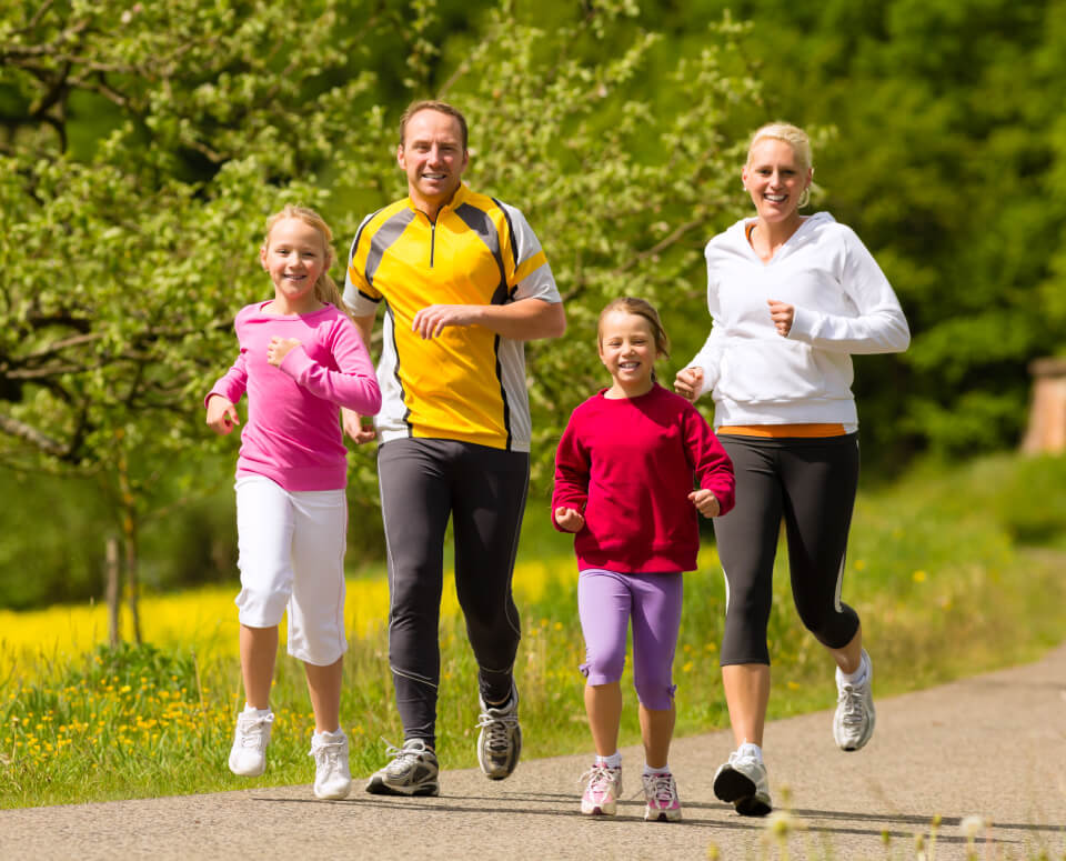 family jogging with smilling face